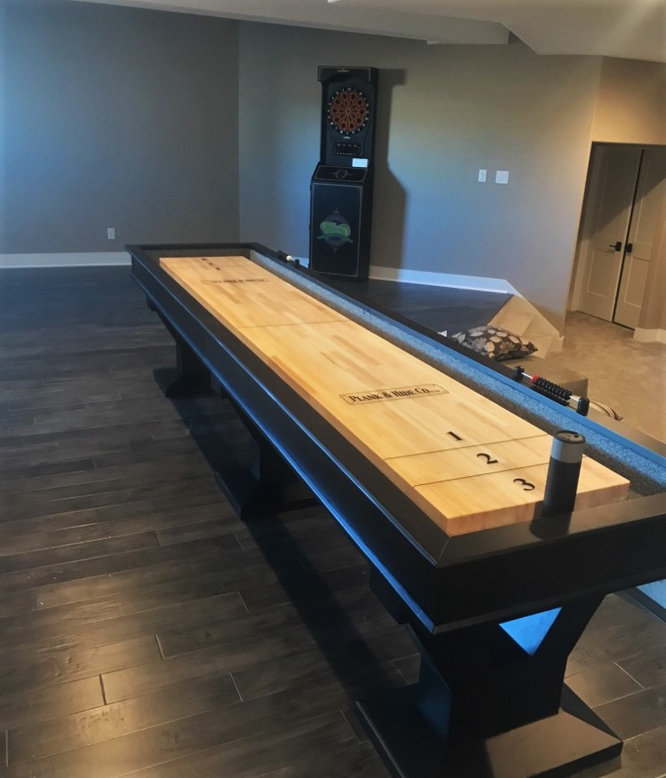 Transmotion Delivery Assembly Installation Relocation of a Plank and Hide 12ft Shuffleboard in Mequon WI Wisconsin Indiana Illinois Washington Michigan Gametable basement Fun Kids Mancave Man Cave