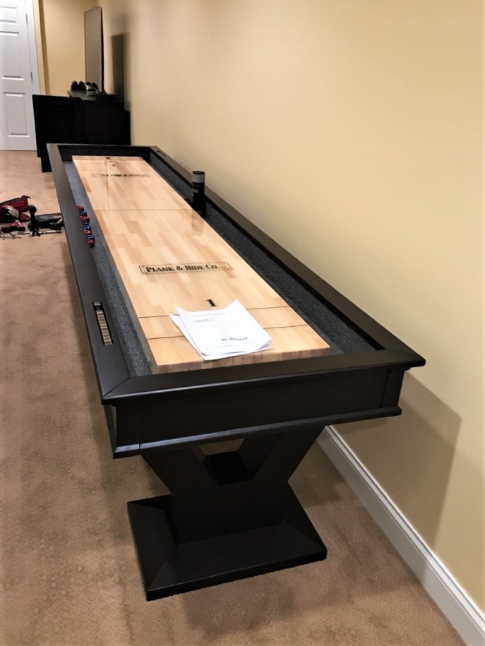 Transmotion Delivery Assembly Installation Relocation of a Plank and Hide 12' Gaston Shuffleboard in Vernon Hills IL Illinois Indiana Wisconsin Washington California Michigan Fun Game Friends Family Play Player America Entertainment United States